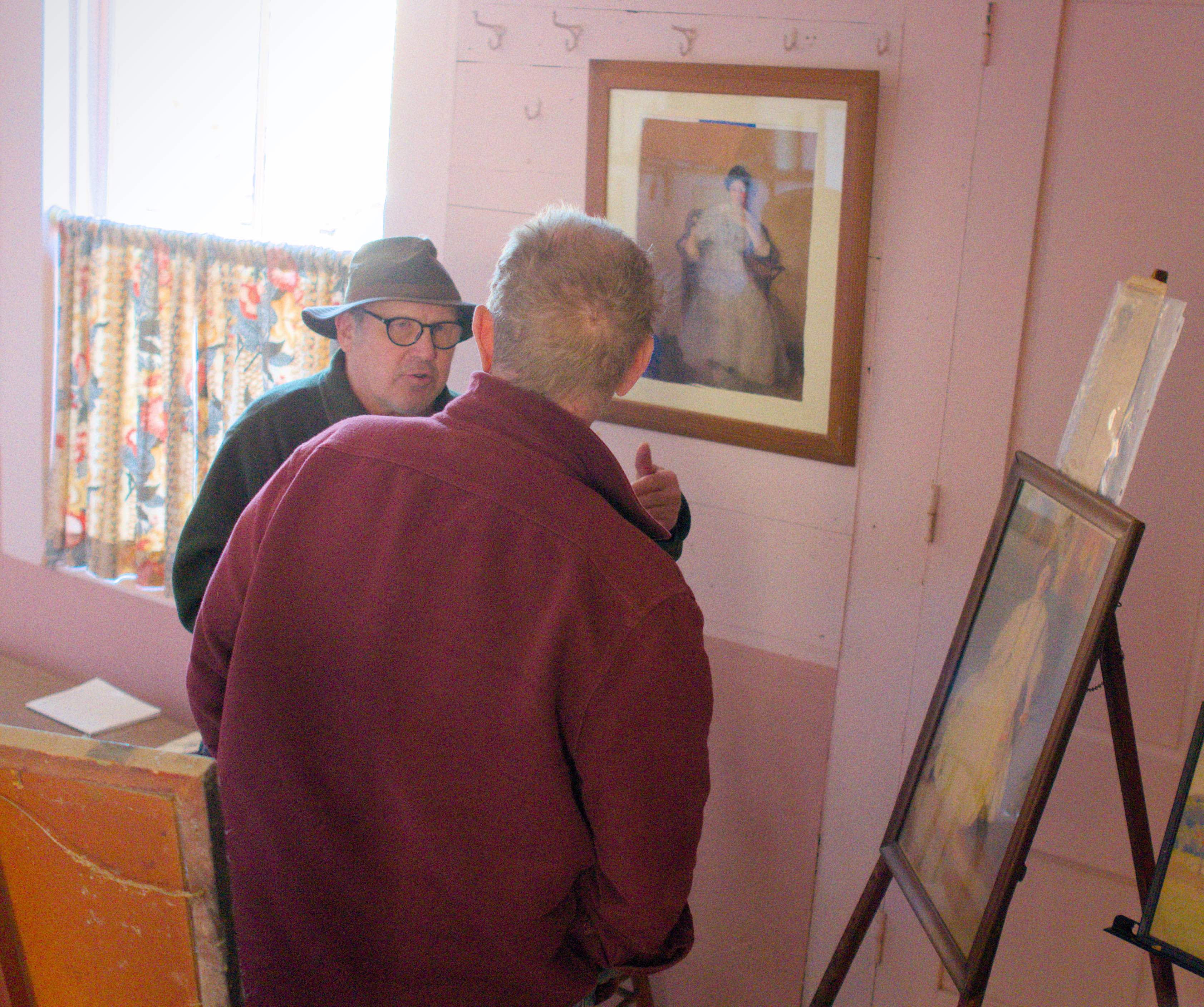 Steve Belcher discussing Hilda Belcher's work on display.